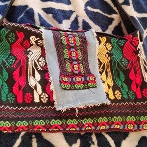 Handmade peacock pattern purse.